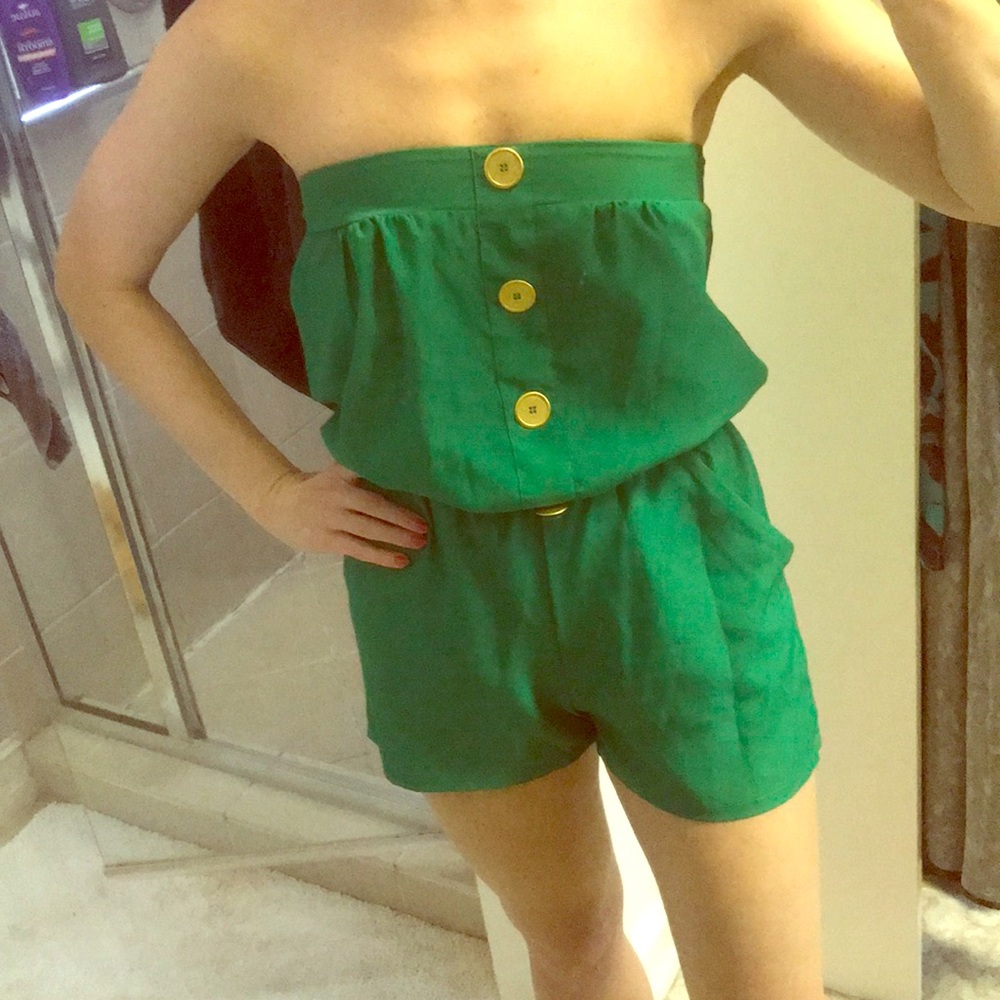 Green romper with gold buttons
